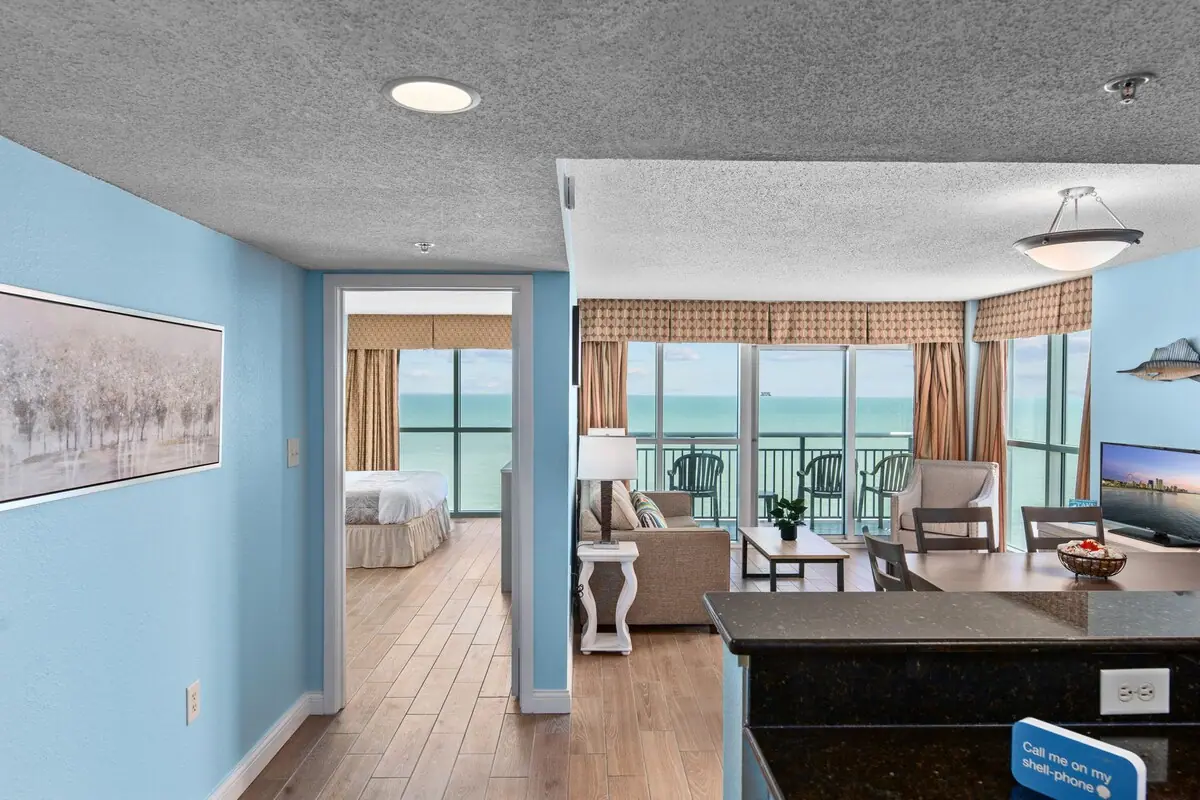 Hallway leading toward the living room and ocean-facing balcony