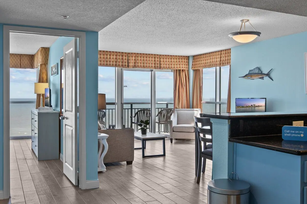 Dining counter overlooking the living room and ocean-facing windows