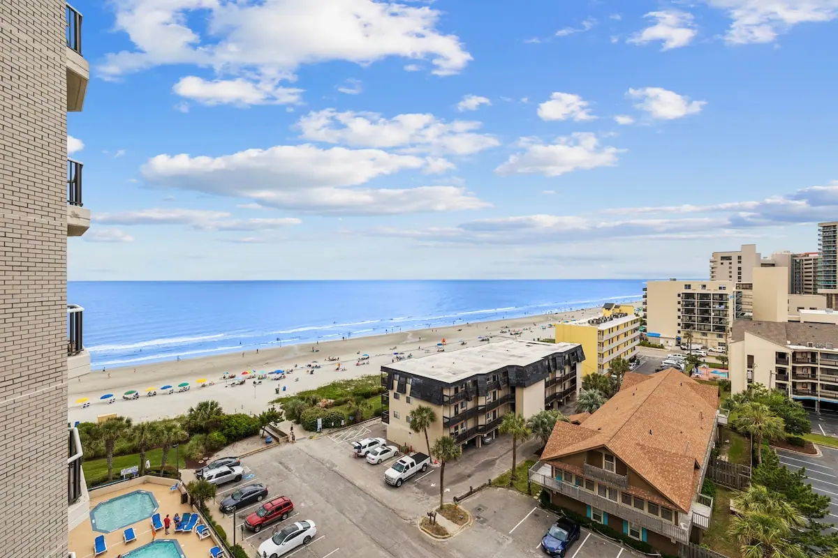Elevated view over the beach, ocean, and nearby buildings