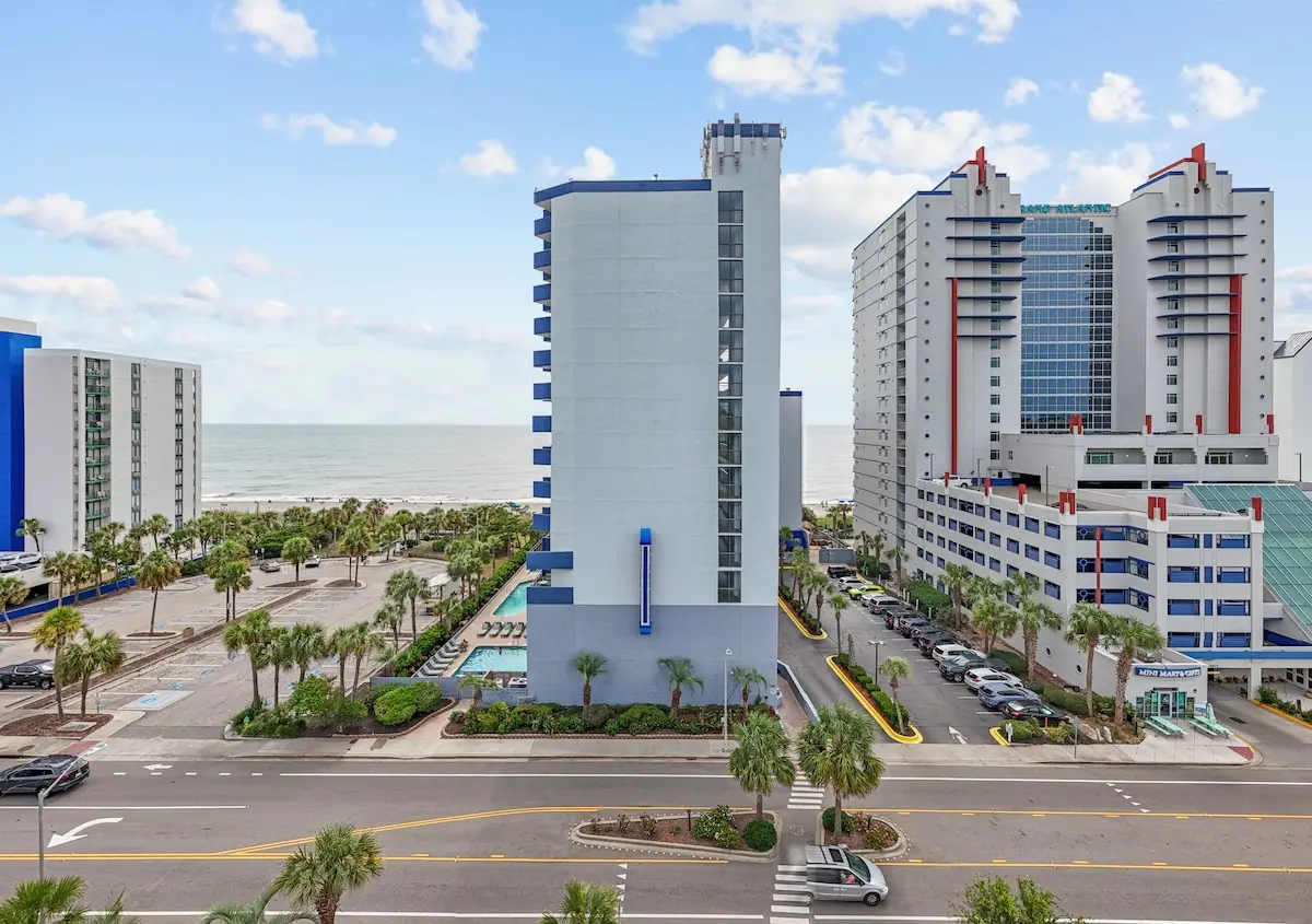 View past oceanfront buildings toward the beach and ocean